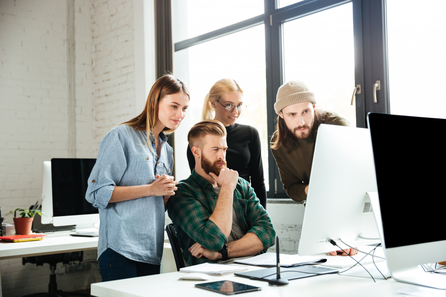 people are looking at the computer monitor
